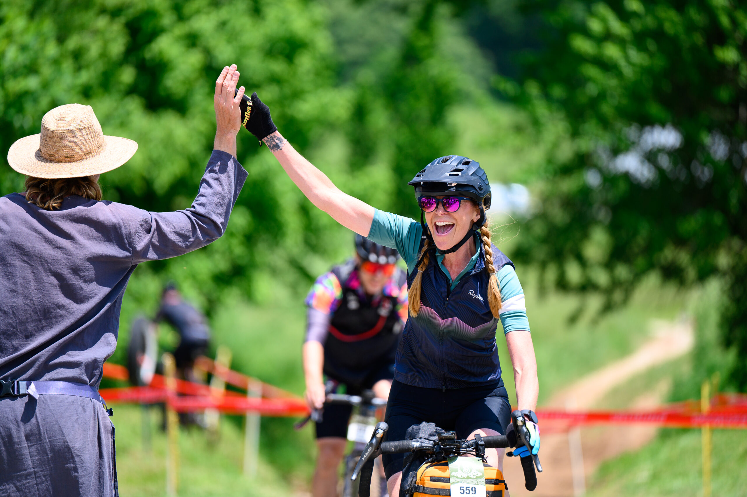 Female rider crossing the finish line